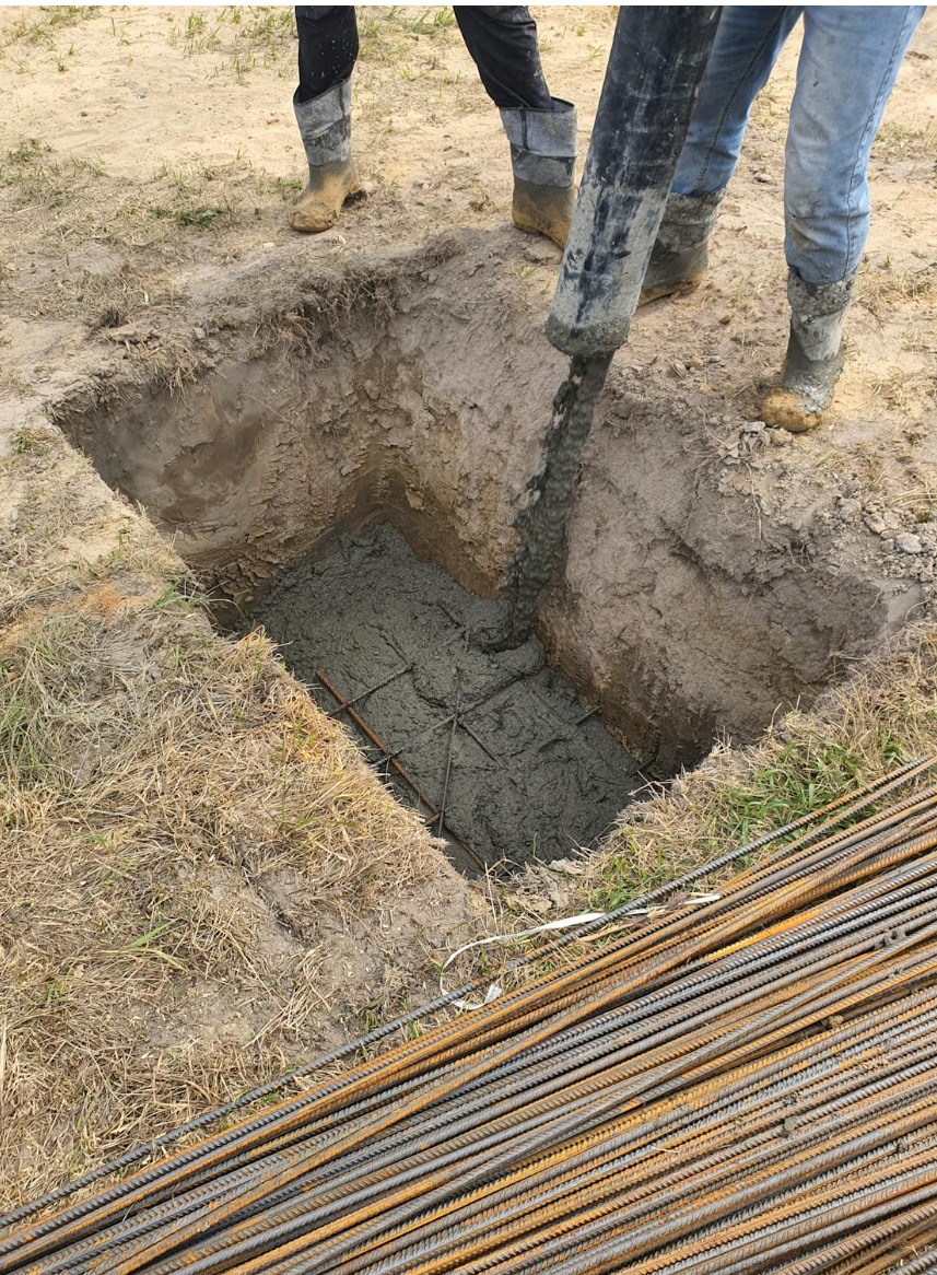 Concrete being poured into foundation